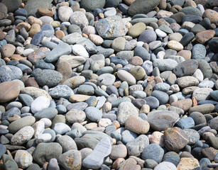 Stone pebbles as an abstract background. Texture.