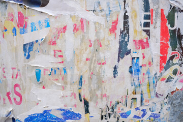 Torn street poster collage background, messy ripped and colorful paper backdrop