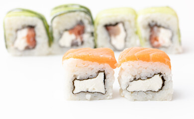 Sushi with fish and cucumber isolated on white background. Close-up