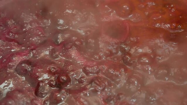 Preparing strawberry jam, close-up