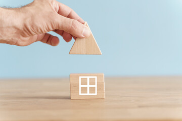 Obraz na płótnie Canvas House business concept. House model on an empty background. Rent, construction, real estate idea