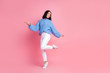 Full body photo of carefree stunning lady enjoy dancing partying empty space isolated on pink color background