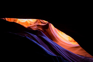 Antelope Canyon in the Navajo Reservation Page Northern Arizona. Famous slot canyon. Light showing off the glamorous detail of the ancient spiral rock arches.