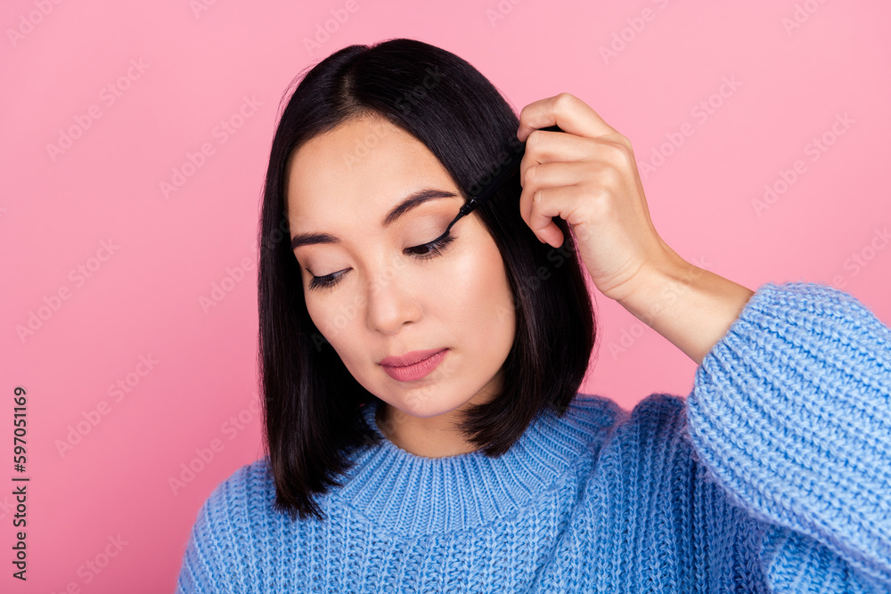 Poster Portrait of nice stunning lady hand hold eyeliner drawing apply cat eye make up isolated on pink color background