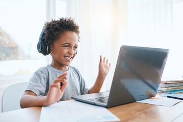 Happy, remote and a child waving on a video call for education, elearning and online class on laptop. Smile, wave and a student greeting for digital school communication from home on a computer