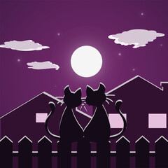 Cats on the fence, against the backdrop of the full moon