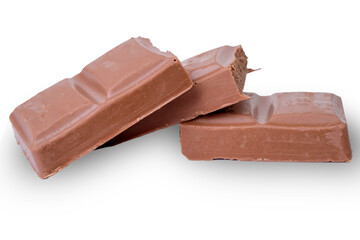 A pile of pieces of chocolate chips on white background	
