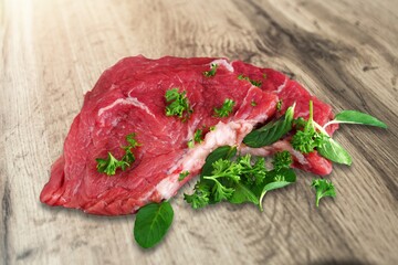 Tasty raw fresh meat on wooden board