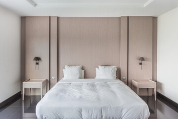 Interior of a hotel bedroom, bedroom with two bedside tables