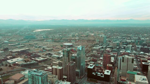 Aerial drone view of Downtown Denver, Colorado during sunset.