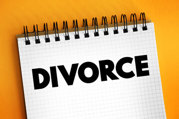 Divorce - canceling or reorganizing of the legal duties and responsibilities of marriage, text concept on notepad