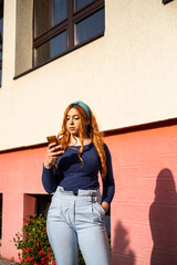 Smiling Young Woman in City Sunlight