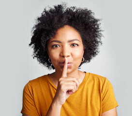 Portrait, woman and secret with finger on lips for privacy, mystery and noise on white background....
