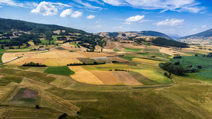 Colfiorito, Umbria. Fields and crops. Play of colors seen from above.