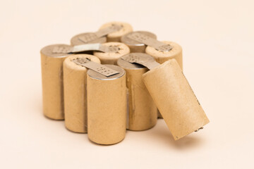 Energy and Environment Ideas. Bundle of Soldered Ni-Mh Rechargeable Batteries  Placed Together Over Beige