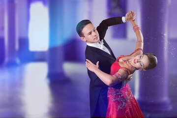 Couple of beautiful dancers dancing on stage