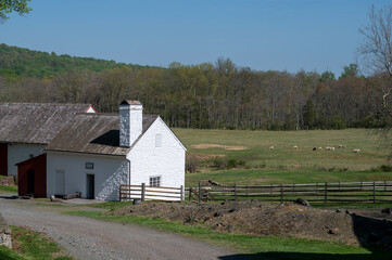 Stone store and agricultural barn building in pastoral village