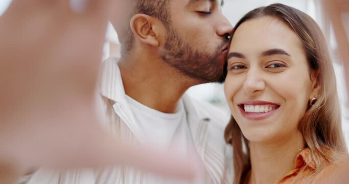 Face, couple and happy selfie on video call, profile picture and social media post. Portrait, perspective and young man kissing woman in photograph with love, care and smile to relax together at home