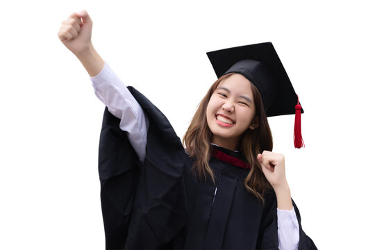 College degree graduations. Happy young Asian girl in gown with mortarboard isolated on white background.