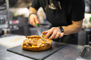 chef hand cooking big large cheese burger on restaurant kitchen. step by step