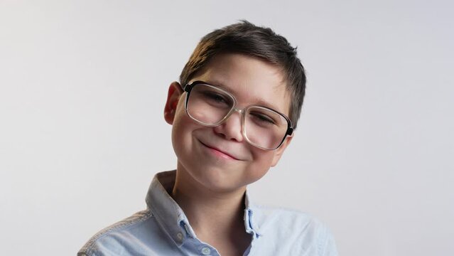 Funny smiling boy with glasses