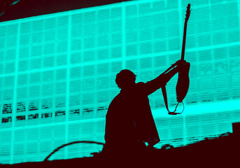 guitarist silhouette in stage lights