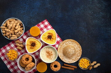 Festa Junina Summer Festival Carnival concept. Brazilian straw hat, popcorn, peanuts and Corn Cakes on Wooden Background for Brazilian Festa Junina Summer Festival