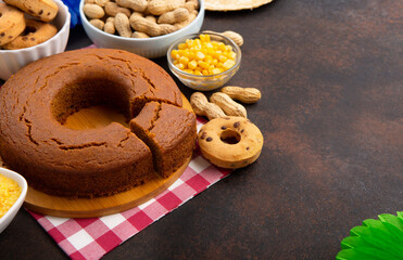Festa Junina Summer Festival Carnival concept. Brazilian straw hat, popcorn, peanuts and Corn Cake on Wooden Background for Brazilian Festa Junina Summer Festival