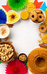 Festa Junina Summer Festival Carnival concept. Brazilian straw hat, popcorn, peanuts and Corn Cake on White Wooden Background