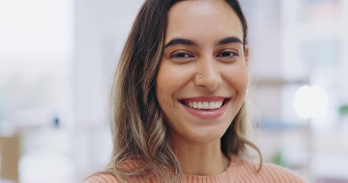 Face, happy and funny with a business woman in the office, laughing at a joke while feeling positive. Portrait, smile and humor with a young carefree female employee having fun in the workplace