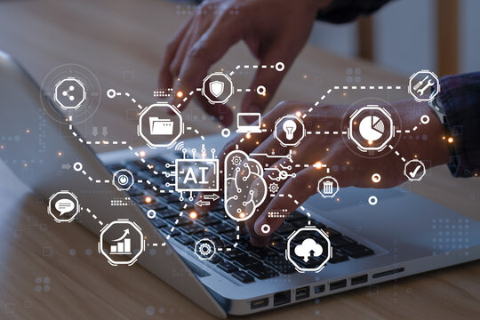 AI (Artificial intelligence) concept. Artificial intelligence Businessman using AI smart robot technology inputting commands to analyze data and build something..
