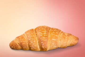 Appetizing fresh tasty croissant on desk