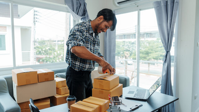 Mixed race Asian indian ethnicity young man chinese transport shipment delivery service sme parcel cardboard box package on delivery small business owner SME, shopping online