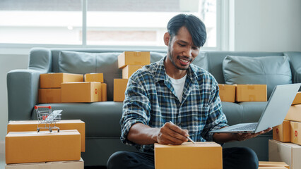 Mixed race Asian indian ethnicity young man chinese transport shipment delivery service sme parcel cardboard box package on delivery small business owner SME, shopping online