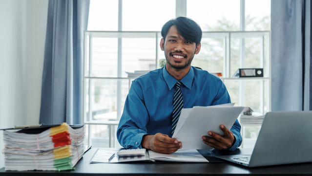Portrait of mixed race positive successful indian asian chinese company ceo businessman freelancer or recruitment broker working in office, smiling friendly