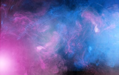 Colorful smoke wave clouds in light on dark background