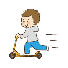キックボードに乗っている男児