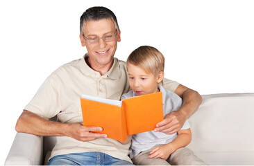 Grandfather and little child reading book happy together at home