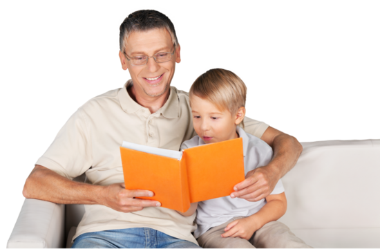 Grandfather and little child reading book happy together at home - Powered by Adobe
