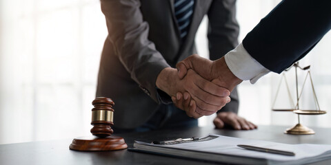 Handshake after cooperation between attorneys lawyer and clients discussing a contract agreement legal fighters, Concepts of law, advice