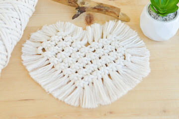 Macrame handmade napkin in the form of heart. Eco diy home decoration. Natural materials, cotton thread. St. Valentine's Day.