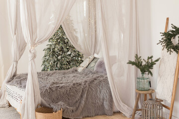 Christmas scandinavian bedroom with white canopy © aprilante