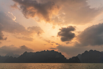 Aerial view of Khao Sok national park Cheow Lan Dam lake. Lanscape of  sunset. Ratchaprapha Dam.