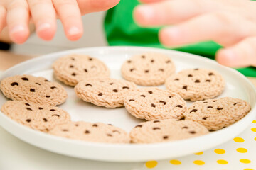 Handmade crochet cookies with chocolate chips. Delicious dinner, sweet snack. Kitchen toys for young children. Sensory cooking games at home. Develop of kids imagination. Roles of professions.
