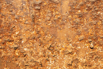 Rust of metals.Corrosive Rust on old iron with a hole. Rusted orange painted metal wall.