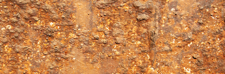 Rust of metals.Corrosive Rust on old iron with a hole. Rusted orange painted metal wall.