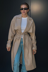 Trendy coat. Fashion boutique advertising. Fashion street style of beautiful model wearing fashion clothes. Fashion accessories. Girl vogue urban style.