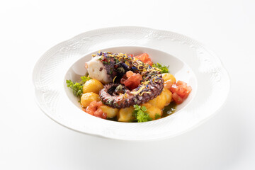 octopus with boiled potatoes and vegetables on a white background