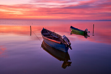 sunrise with boats on the lake in the Danube Delta 7