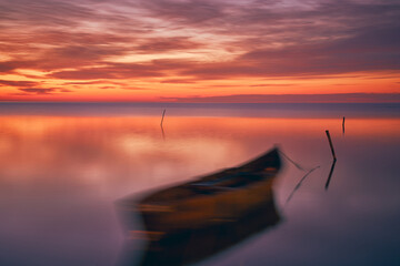 sunrise with boats on the lake in the Danube Delta 3